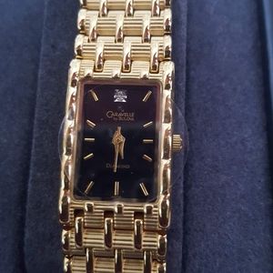 Caravelle gold tone watch new